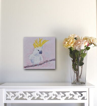 A textured oil painting of a white Sulphur Crested cockatoo with a vibrant yellow crest. The bird is perched on a branch. 