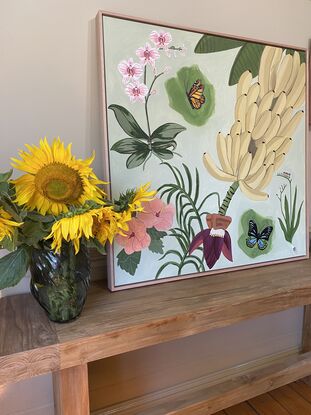 A flurry of butterflies in the wild amongst a scene of botanical flora. And we can't forget the bunch of bananas, everyone loves bananas! Framed in flooded gum