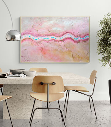 The Sweetest Stream is a colourful textured aerial landscape in pink and peach tones with vivid blue winding river dotted with tiny trees running horizontally through the landscape.