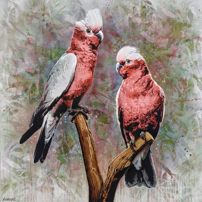 two pink galahs sit on a branch with an abstract nature foliage in the background, in earthy bush colours