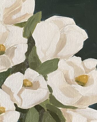 White flowers in a beige vase on a warm background.