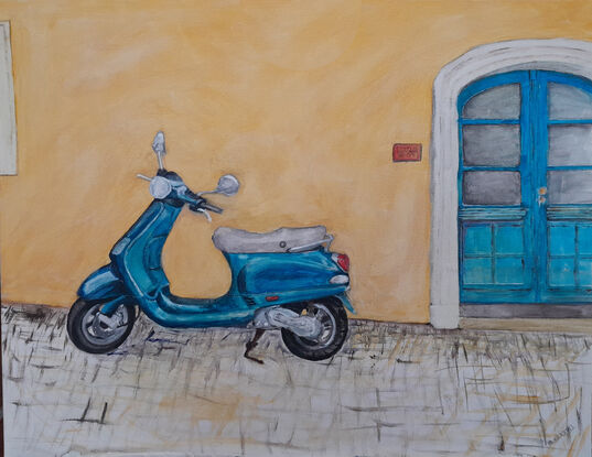 A Blue Vespa scooter parked on cobblestones outside an Italian stucco building.  To the right of the scooter is a large, arched, blue, double-doorway.