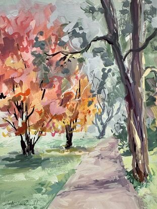 Trees with red leaves with a path winding through