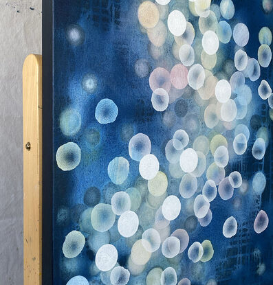 Abstract painting with dots and organic forms reminiscent of science, the sea or underwater. Colourful with many layers of colour and floating forms. Photographic lights, like bokeh. A unique mixing of original abstract art with microbiology and science. Cellular art. Jelly fish forms. Blue and White and some pale grey tones. Calming and peaceful.