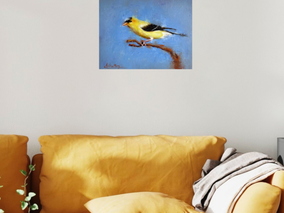 A yellow bird on a blue ground.