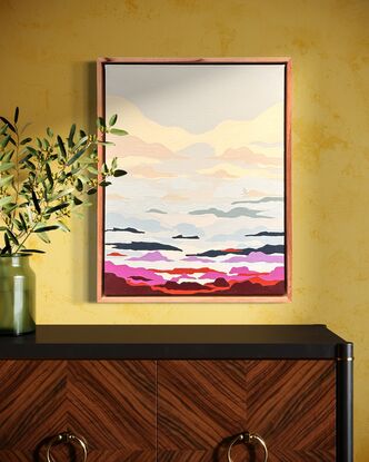 an abstract painting of a cloudy sky, depicting the sunset. Large cream and white clouds turn into scattered blue, pink, red, purple, dark blue and orange clouds. A tiny silhouette of a surfer can be found surfing one of the clouds, like it's a wave. the painting is framed in reclaimed Tasmanian Oak timber.