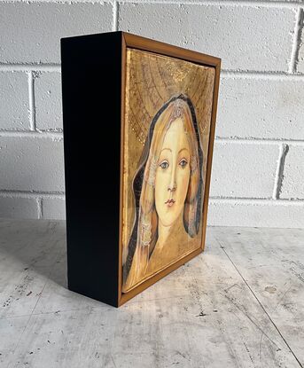 A medieval technique used for icon work, I workshopped in Italy. Rabbit skin glue gesso is applied in many layers to seasoned timber panel; more layers of Armenian red earth bole; then water-gilded 23kt gold leaf, burnished and tooled; painted with egg tempera; then sealed with epoxy resin to protect delicate surface. This Madonna is referenced from Botticelli's 15th century work.