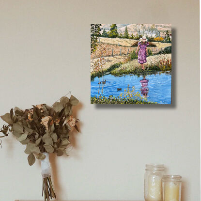 Woman at pond in country.  Farmhouse in background. Ducks in water. Reflections. Paddocks of dry meadow.