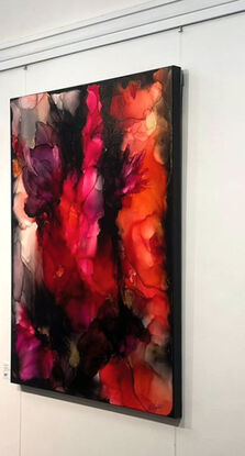 Large abstract painting on canvas  in tones of red and black with gold metallic highlights depicting fire ice and floods