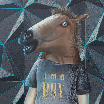 A boy in a horse mask stands in front of a wall featuring a geometric pattern. Six rubber ducks are levitating near him, two of them glowing neon blue. The boy wears a t-shirt with the print 'I'm a Boy.'