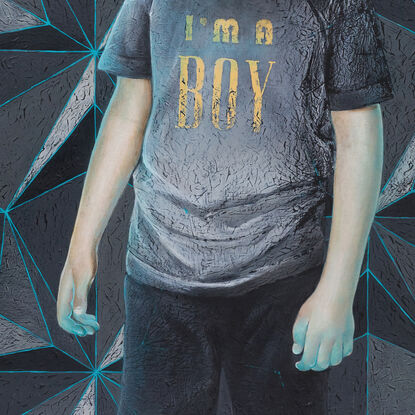 A boy in a horse mask stands in front of a wall featuring a geometric pattern. Six rubber ducks are levitating near him, two of them glowing neon blue. The boy wears a t-shirt with the print 'I'm a Boy.'