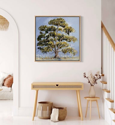 A large green gum tree is captured with loose brush strokes with a blue background 