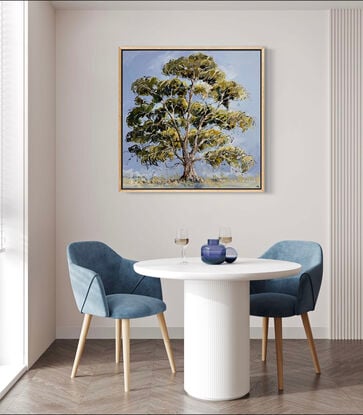 A large green gum tree is captured with loose brush strokes with a blue background 