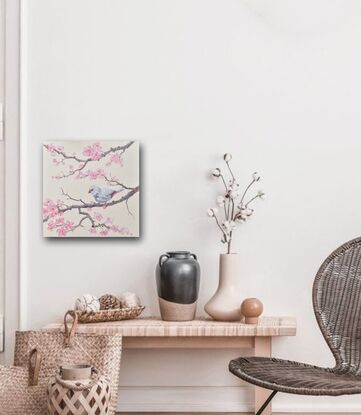 A thickly textured oil painting of a Silver Diamond Firetail Finch perched on a branch of pink Japanese Cherry Blossom. The small bird is a pale silver colour with red on its tail.