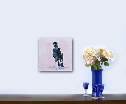 Palette knife oil painting of a black and white Australian native Magpie. The background is painted a pale pink blush colour.