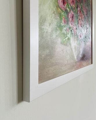 A white flower vase with a bunch of red flowers on a large canvas