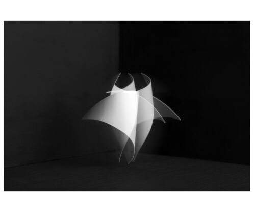 A white paper shape against a black background 