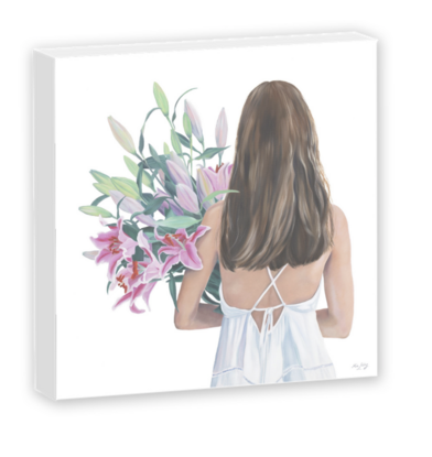 A woman/girl holding a huge bunch of Lillies. 