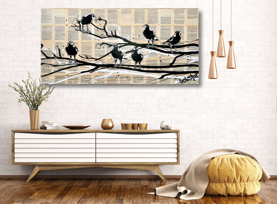 magpies sitting on a branch on book pages