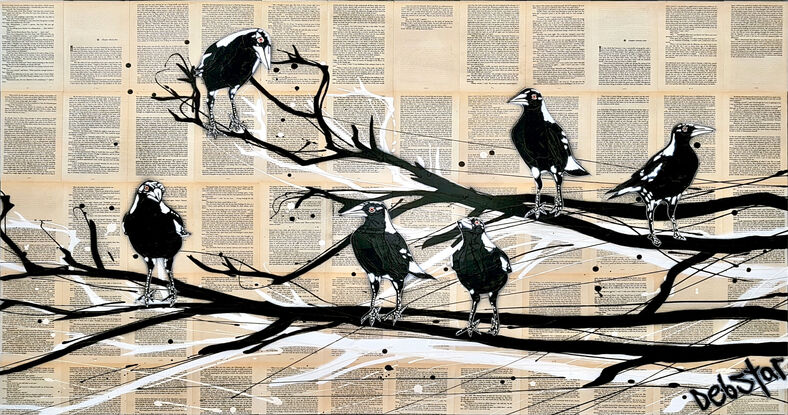 magpies sitting on a branch on book pages