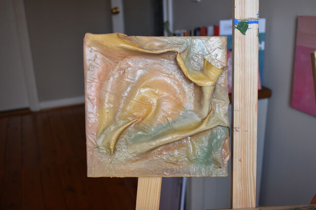 Blended colours over a moulded 3D element that protrudes from the canvas 