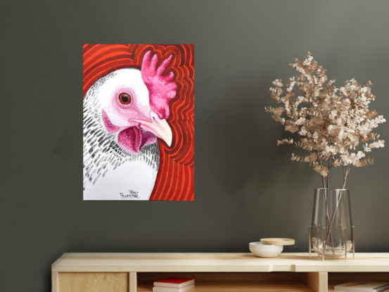 White and black speckled rooster head on orange pop background