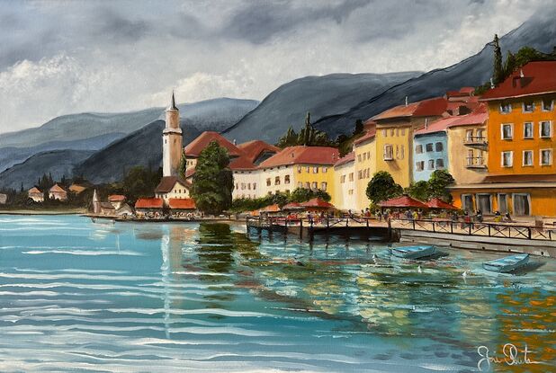 Buildings and boats on the shore of Lake Annecy in France