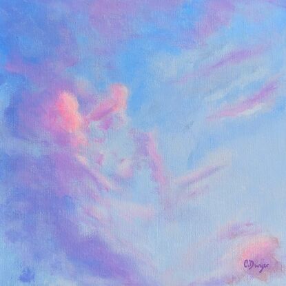 Sunset clouds of deep blues and purples with patches of pink against a cobalt sky