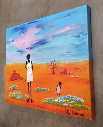 Lady walking with her child  in the Outback.