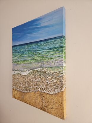 Oil painting of the view of the ocean from standing on the beach. The colors of sea are blue, light green and turquoise. The sand is ochre. 