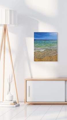 Oil painting of the view of the ocean from standing on the beach. The colors of sea are blue, light green and turquoise. The sand is ochre. 