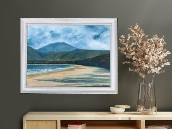 Four Mile Beach Far North Queensland Port Douglas with mountains in background and a lone seagull in the sky