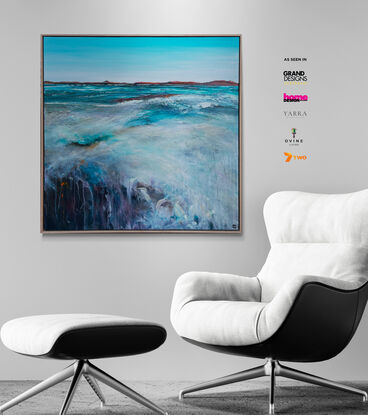 Framed Colourful abstract seascape with pale teal blue sky, and seascape with lots of movement and texture with mountain range in the horizon.