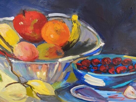 Rich colours of flowers and fruit on a dark background provide drama to a still life.