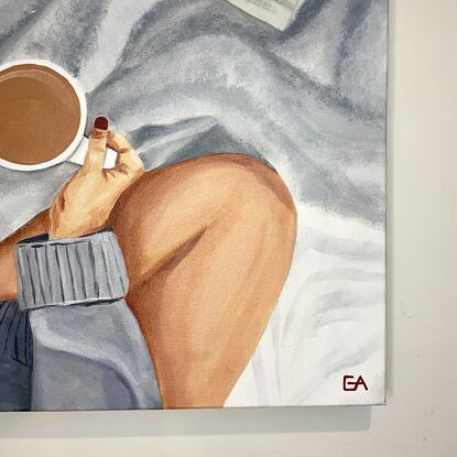 Girl on bed relaxing with coffee