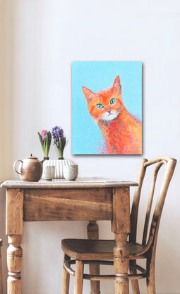 Painting of an orange coloured Marmalade cat with green eyes. The background is painted turquoise blue.