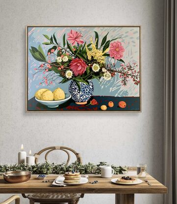 A still life painting of flowers and fruit in blues, reds, oranges, yellows, whites, pinks and greens, framed in oak