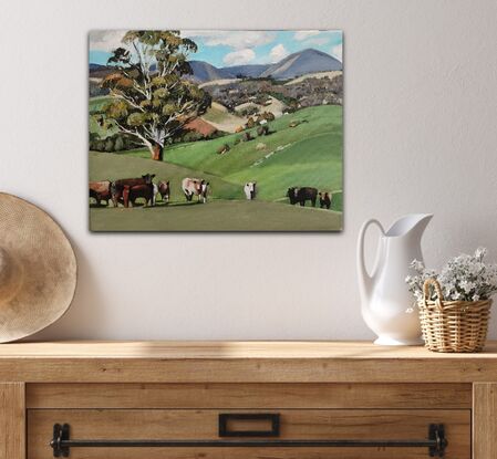 Rural Australian Landscape depicting cattle in the foreground  and rolling hills in the background.