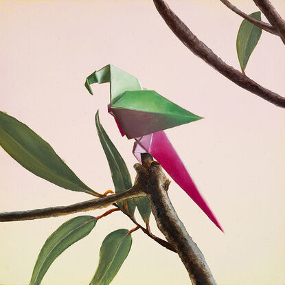 A purple and pink origami parrot perched on a bare branch with purple flowers growing. 