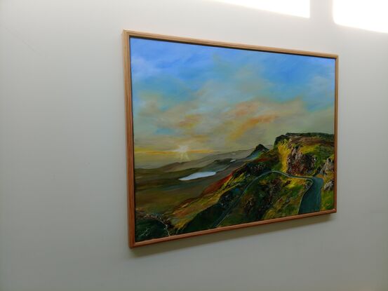 Picturesque dawn painting of green fields, rocky outcrops and rolling plains