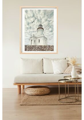 Lighthouse and clouds in background at Byron Bay