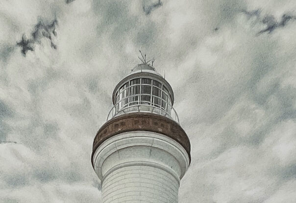 Lighthouse and clouds in background at Byron Bay