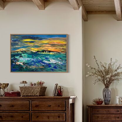 Rich orange and golden yellow sunset envelopes the sky, the choppy waters below  in  a palette of stunning  teals and blues creates  movement in the painting that draws the eye into the canvas.  The sky, the ocean and the island create a stunning painting suitable
For any decor. 