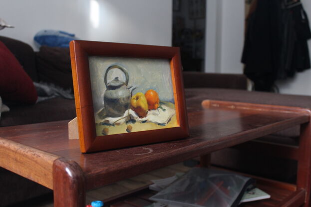 Original oil painting of grey kettle/pot and two pieces of fruit on table.