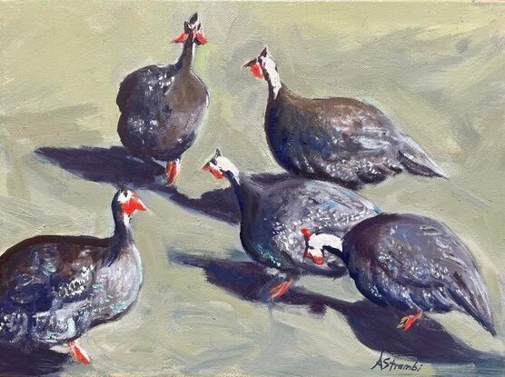 A group of guinea fowl enjoying a sunny garden