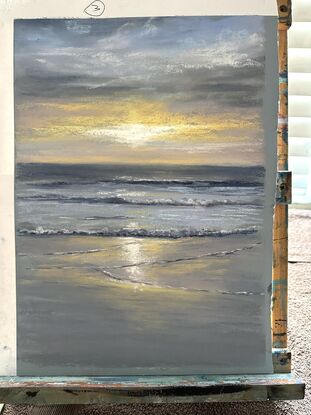 Grey and blue warm glow from the sun setting in the beach 