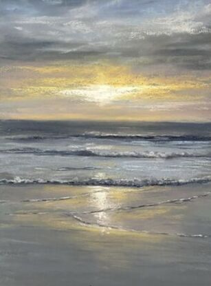 Grey and blue warm glow from the sun setting in the beach 