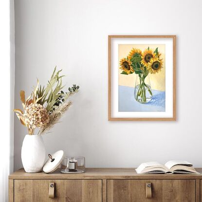 Large sunflower bouquet in glass vase