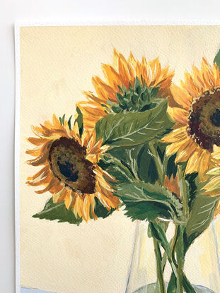 Large sunflower bouquet in glass vase