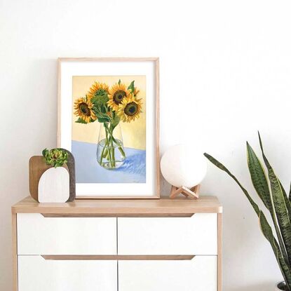 Large sunflower bouquet in glass vase